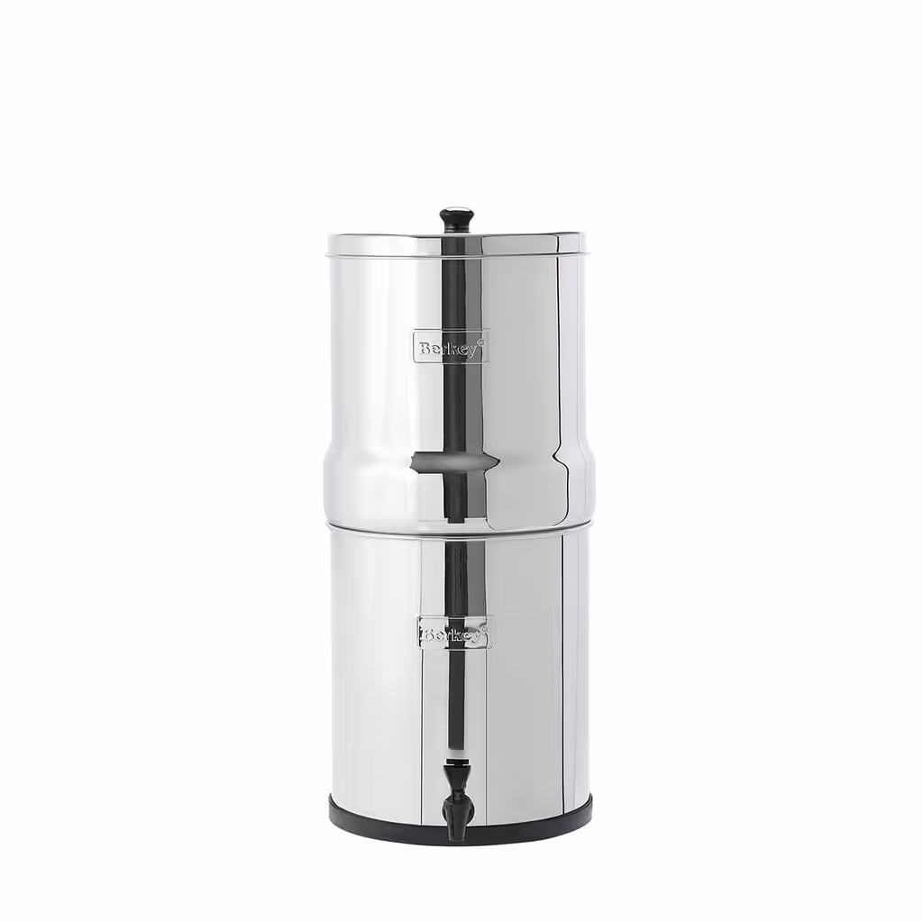 Big Berkey gravity water filter: a polished stainless-steel countertop system with an upper and lower chamber and a front spigot, standing on a white background