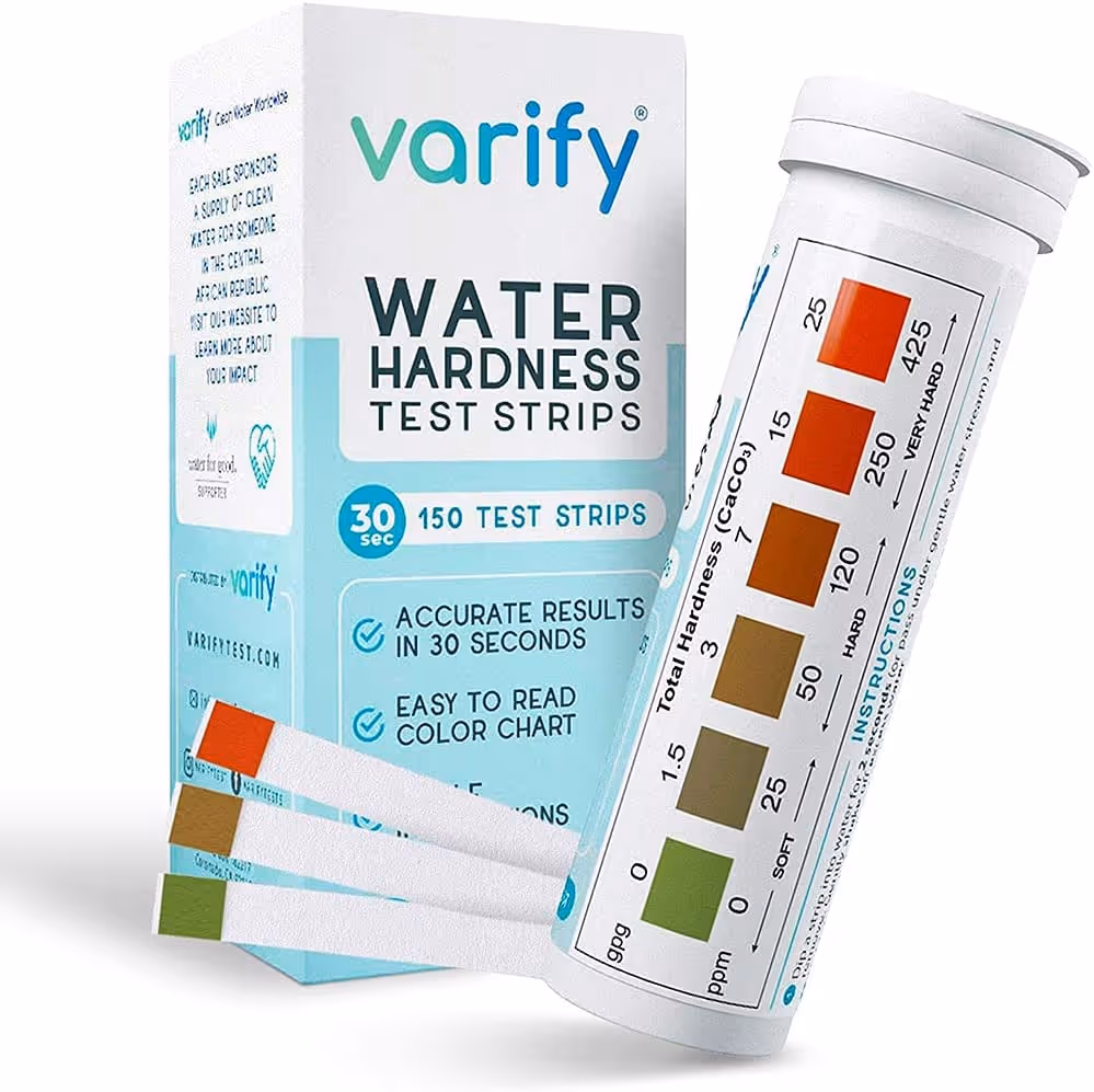 Varify water hardness test strips: a bottle of color-match strips beside its printed hardness reference chart reading in ppm and grains per gallon