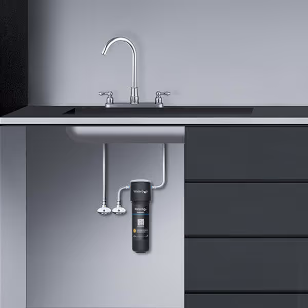 Waterdrop 17UA under-sink direct-connect water filter: a slim black cylindrical filter mounted under a kitchen sink and tapped into the cold-water line, with no separate faucet